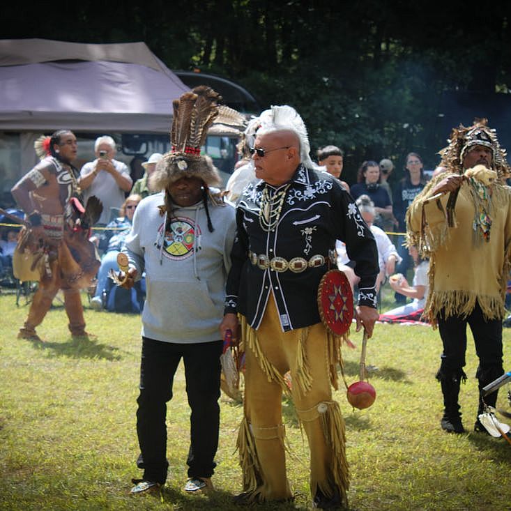 Two men talking at the Nipmuck Powwow